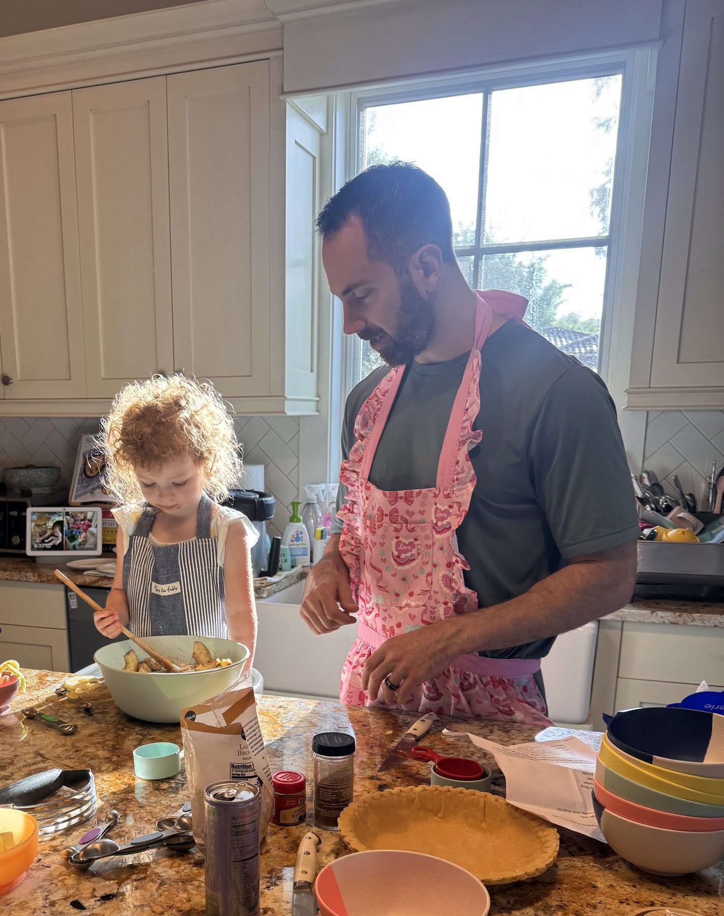 Jesse baking in the kitchen with his daughter