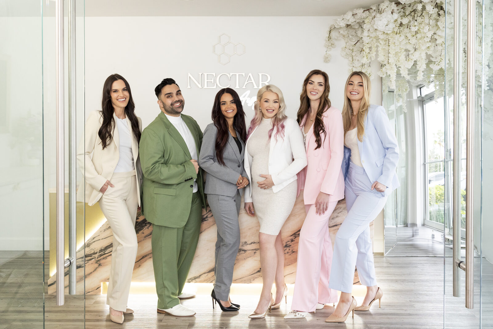 A medical spa team gathered in the reception area